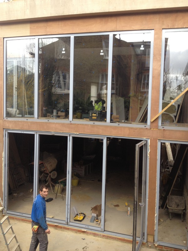 Aluminium bi-fold doors with two-storey glazing in Lewisham