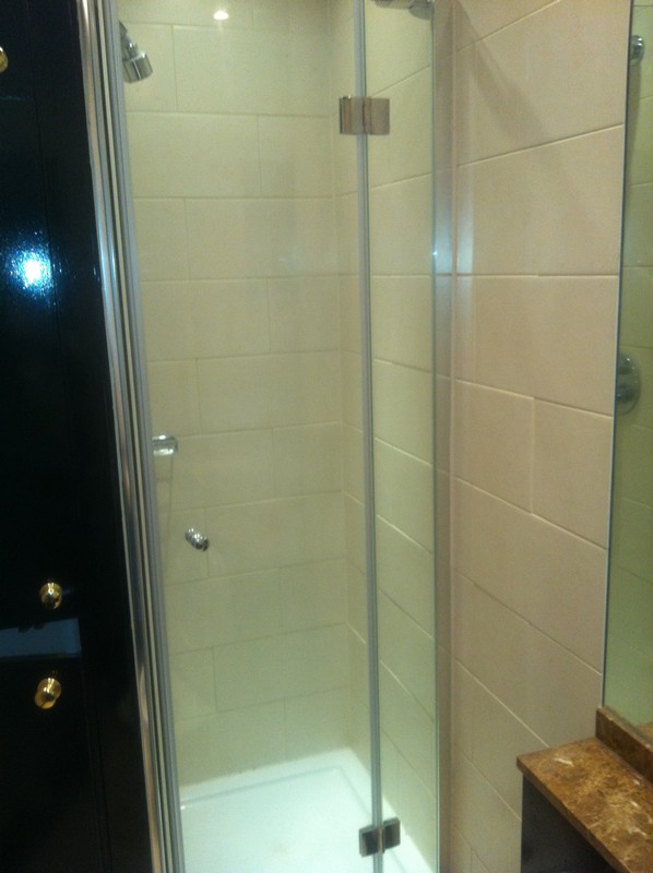 Frameless glass shower enclosure with chrome fittings in Lewisham