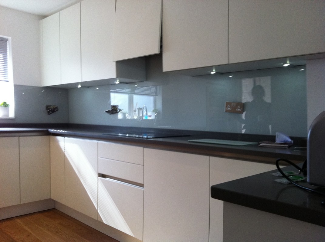 Grey glass kitchen splashback with LED lighting in Lewisham