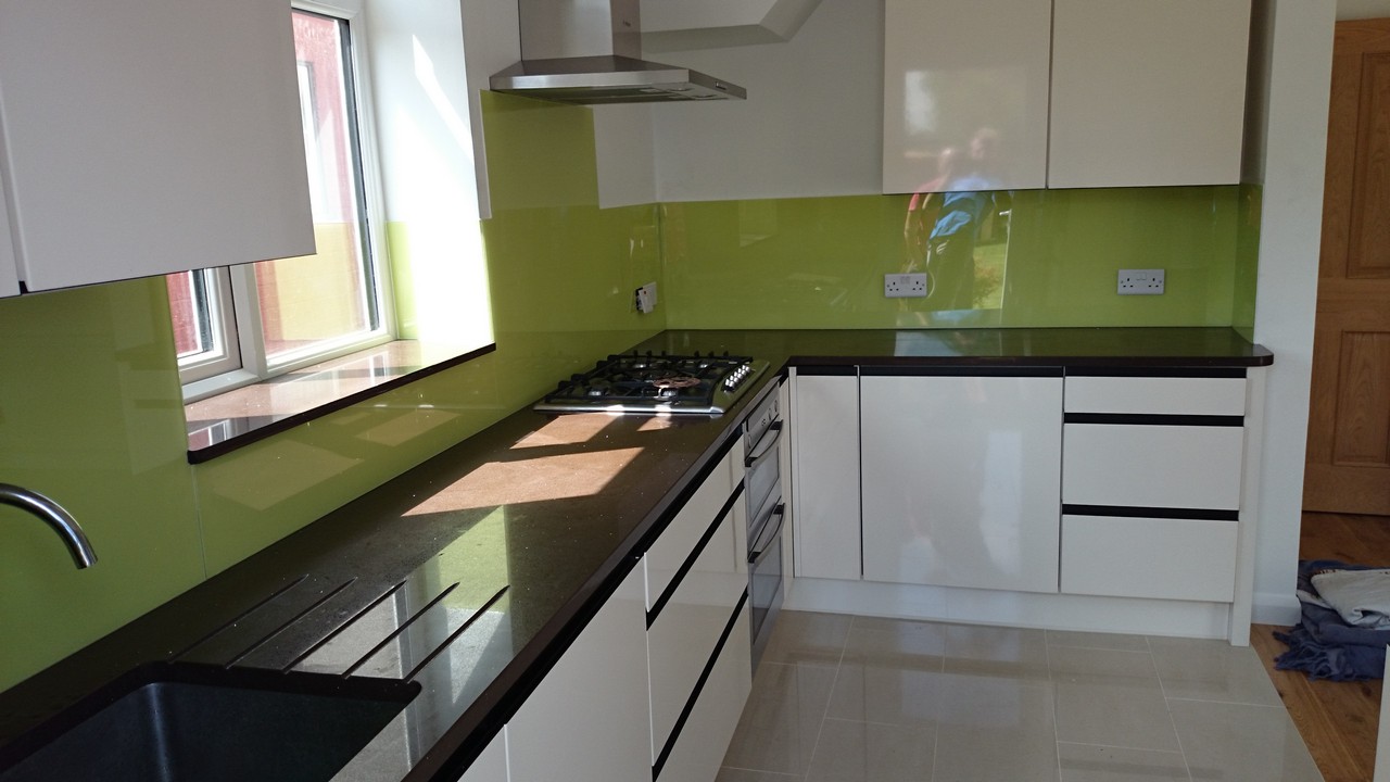 Lime green glass kitchen splashback installed by Lewisham glaziers