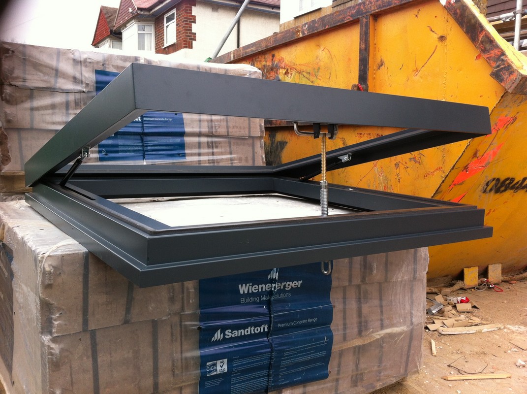 Opening flat roof skylight in anthracite grey installed in Lewisham