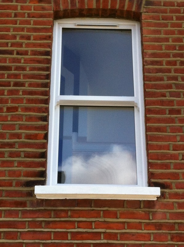 uPVC sash window on Victorian red brick house in Lewisham